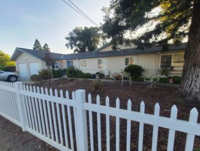 San Jose apartment for rent - A white picket fence in front of a house.