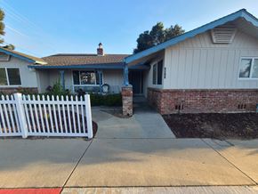 San Jose apartment for rent - A house with a white picket fence in front.