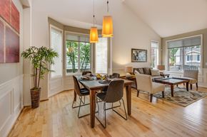 San Jose apartment for rent - A dining room with a table set for six.