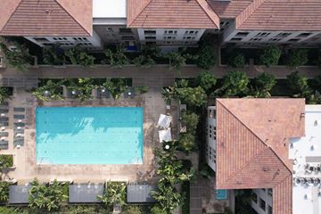 Santa Clara apartment for rent - A swimming pool surrounded by trees and buildings.