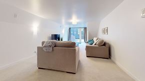 San Jose apartment for rent - Two beige couches in a room with a door in the background.