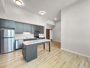 International Falls apartment for rent - an open kitchen with stainless steel appliances and a counter top