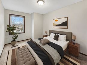 St. Paul townhouse for rent - a bedroom with a bed and a window