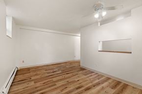 Minneapolis apartment for rent - a living room with white walls and wood floors