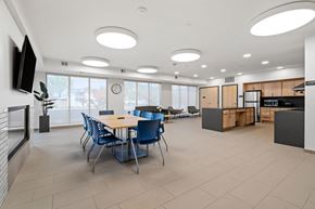 Hopkins apartment for rent - a dining room with tables and chairs in a large room with a ceiling full of