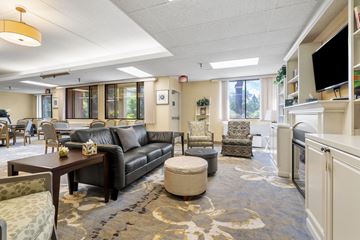 Roseville apartment for rent - a living room with couches and chairs and a table