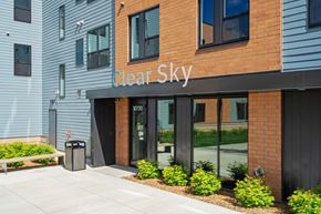 Elk River apartment for rent - The front of a building with the name "Clear Sky" on it.