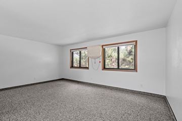 Minneapolis townhouse for rent - the living room of a house with a window and carpet