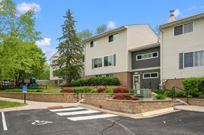 Eden Prairie apartment for rent - an apartment building with a pedestrian crossing in front of it