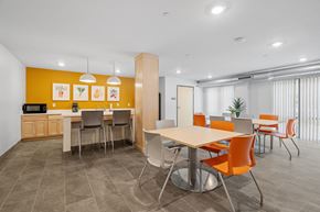 Minneapolis apartment for rent - A modern dining area with a table surrounded by chairs.