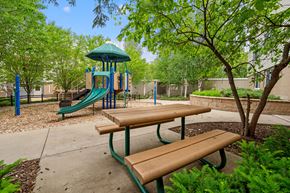 Eden Prairie apartment for rent - a playground with a slide and benches in a park