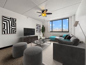 Minneapolis apartment for rent - an open living room with a large window and a ceiling fan
