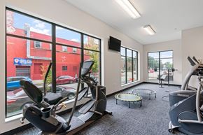 Minneapolis apartment for rent - a gym with exercise equipment and large windows