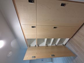 Minneapolis apartment for rent - A wooden cabinet with a black handle and a black lock.