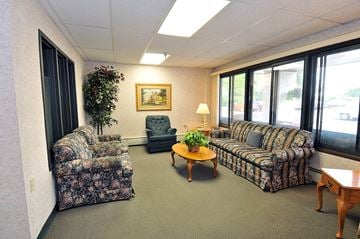 Park Rapids apartment for rent - a living room with couches and chairs and a table
