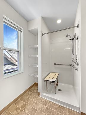 St. Paul apartment for rent - a white bathroom with a shower and a window