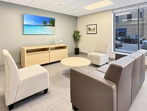 Mankato apartment for rent - A waiting room with a flat screen TV mounted on the wall.