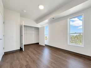 Cottage Grove apartment for rent - A room with a sliding door and a window showing a tree.