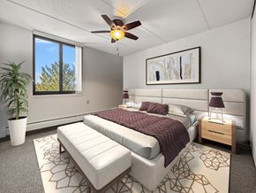 Minneapolis apartment for rent - a bedroom with a bed and a ceiling fan