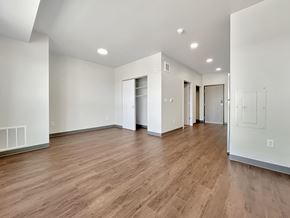 Cottage Grove apartment for rent - A room with wooden floors and white walls.