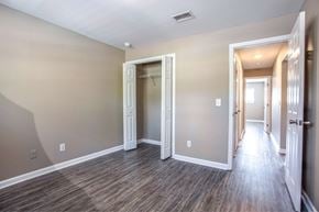 Warner Robins apartment for rent - the living room and hallway of a new home with wood flooring