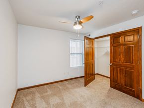 Bridgeport townhouse for rent - an empty bedroom with a closet and a ceiling fan