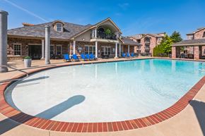 North Little Rock apartment for rent - a large swimming pool with a house in the background