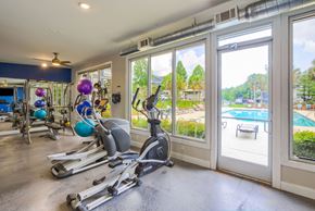 Opelika apartment for rent - a home gym with a view of the pool
