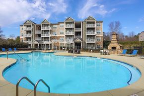 Macon apartment for rent - a large swimming pool with an apartment building in the background