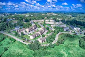 Morgantown apartment for rent - A bird's eye view of a residential area with multiple buildings and greenery.