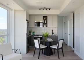 Ottawa apartment for rent - A modern kitchen with a dining table set for two.