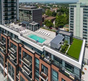 Ottawa apartment for rent - an aerial view of a building with a pool on top of it