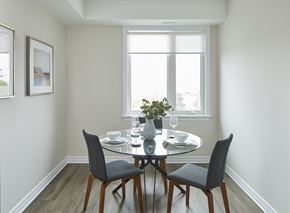 Ottawa apartment for rent - a dining room with a table and chairs and a window