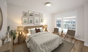 Kanata townhouse for rent - a bedroom with a large bed and a window