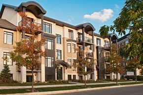 Ottawa apartment for rent - a rendering of a row of apartment buildings on a city street