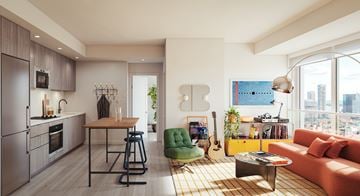 Toronto apartment for rent - A modern kitchen with a dining area and a living room with a guitar on the wall.