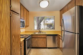 Santee apartment for rent - a kitchen with a sink and a refrigerator