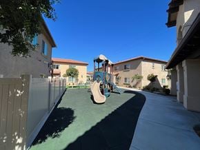 El Cajon apartment for rent - a playground in the middle of a sidewalk between two houses