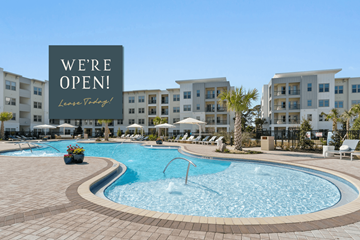 Sarasota townhouse for rent - A pool area with a sign that says "We're Open! Love Tidbits!"