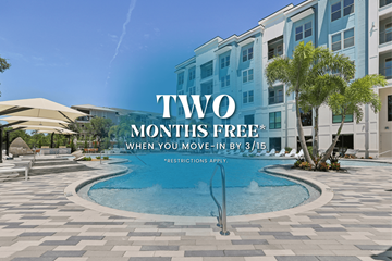 Lakewood Ranch apartment for rent - A pool surrounded by a building with a sign that says "Two Months Free".
