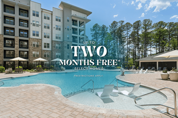 Durham apartment for rent - A swimming pool in front of a building with the text "UP TO TWO MONTHS FREE SELECT HOMES" on it.