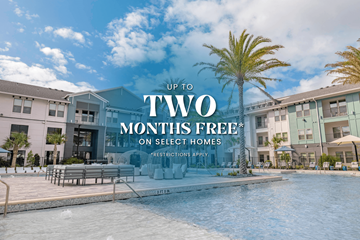 Jacksonville apartment for rent - A pool in front of apartment buildings with a sign offering two months free on select homes.