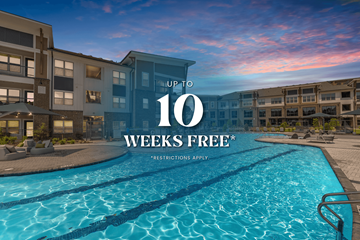 Mooresville townhouse for rent - A swimming pool in front of apartment buildings with a sign that says "UP TO 10 WEEKS FREE".
