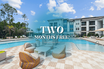 Jacksonville apartment for rent - A poolside with a sign that says "TWO MONTHS FREE".