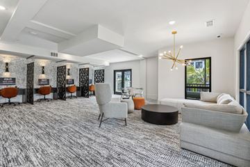 Venice townhouse for rent - A modern living room with a grey carpet and a large window.