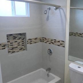 Los Angeles apartment for rent - A white bathroom with a shower and a toilet.