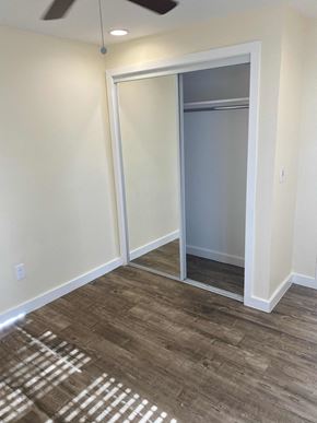 Los Angeles apartment for rent - A room with a sliding door and a ceiling fan.