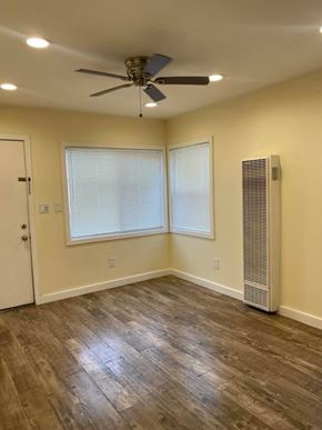 Los Angeles apartment for rent - A room with a ceiling fan and a window with blinds.