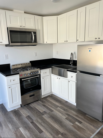Los Angeles apartment for rent - a kitchen with stainless steel appliances and white cabinets