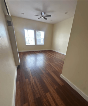 Los Angeles apartment for rent - A room with a ceiling fan and wood flooring.